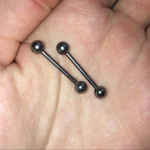 Silver nipple piercings